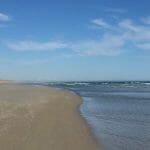 On the beach at Fitzroy River Reserve looking towards the Codrington Wind Farm