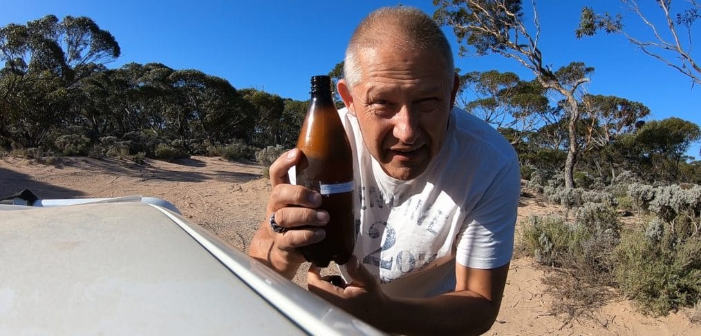 Vic opening his Coopers Craft Pale Ale on the Nullarbor