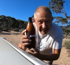 Vic opening his Coopers Craft Pale Ale on the Nullarbor