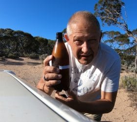 Vic opening his Coopers Craft Pale Ale on the Nullarbor
