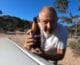 Vic opening his Coopers Craft Pale Ale on the Nullarbor