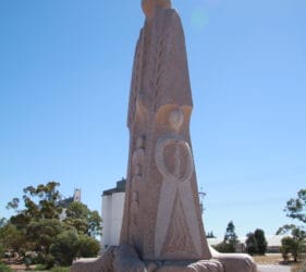 Plaque showing back and left side of The Australian Farmer, Wudinna
