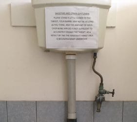 Sign in men's toilet at Spear Creek Caravan Park