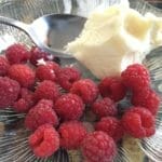 Enjoying local raspberries from Leonie's cousin