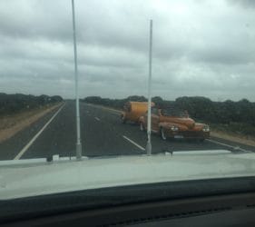 Matching gold car and camper east of Caiguna